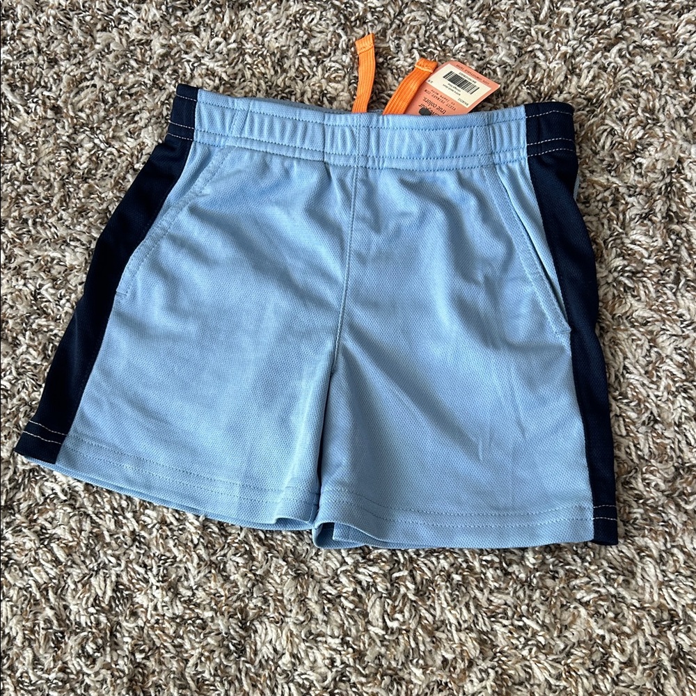 Primary Light Blue Shorts with Orange Accent